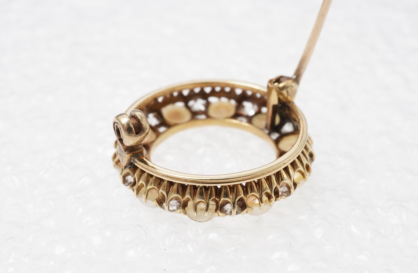 A late Victorian split pearl and diamond brooch, circa 1900